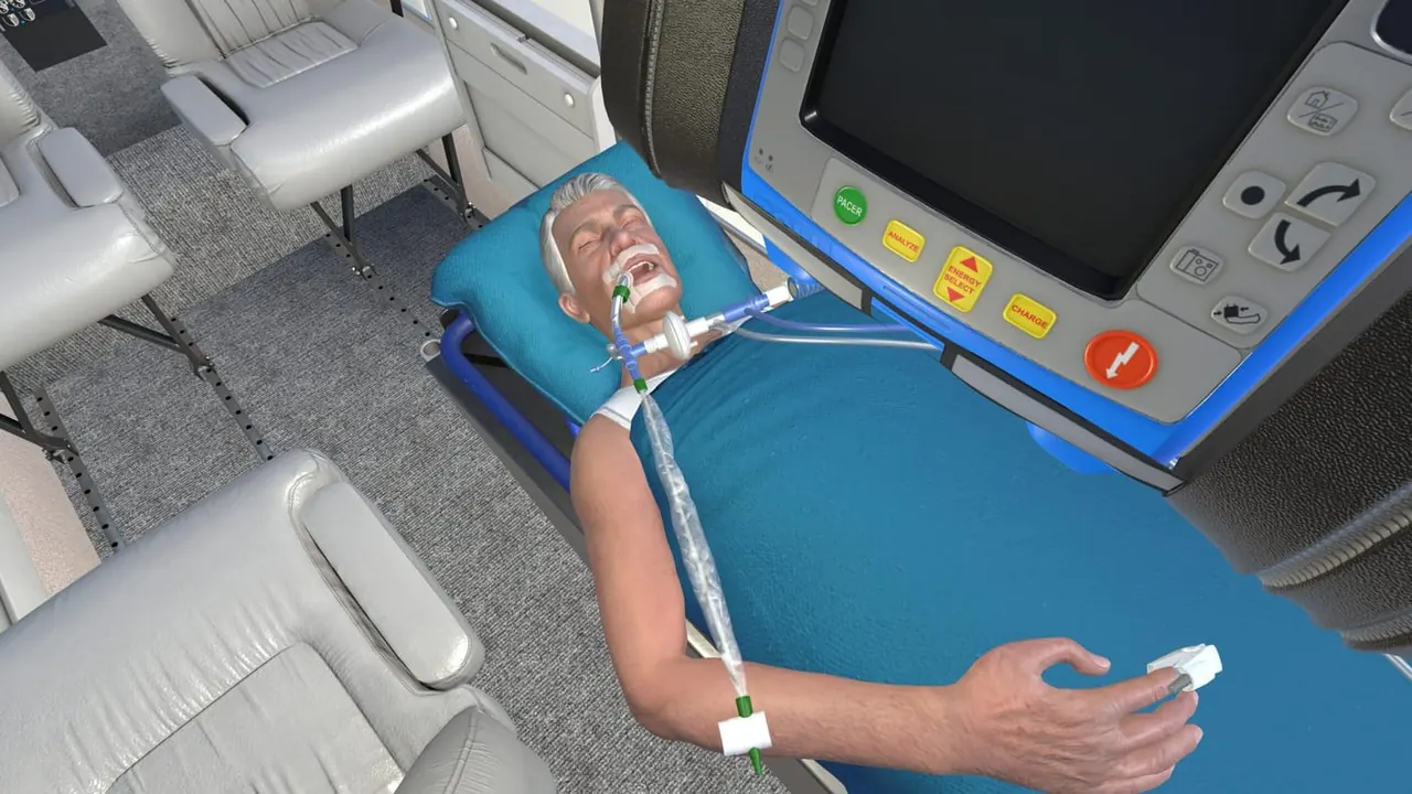 The virtual patient on the stretcher in the VR simulator, with the patient monitor beside