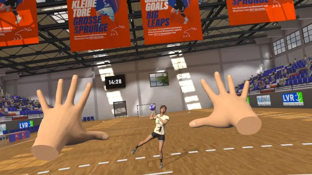 VR-nézet: a kapus két keze a virtuális kézilabda-csarnokban, a lövő a hétméteresen